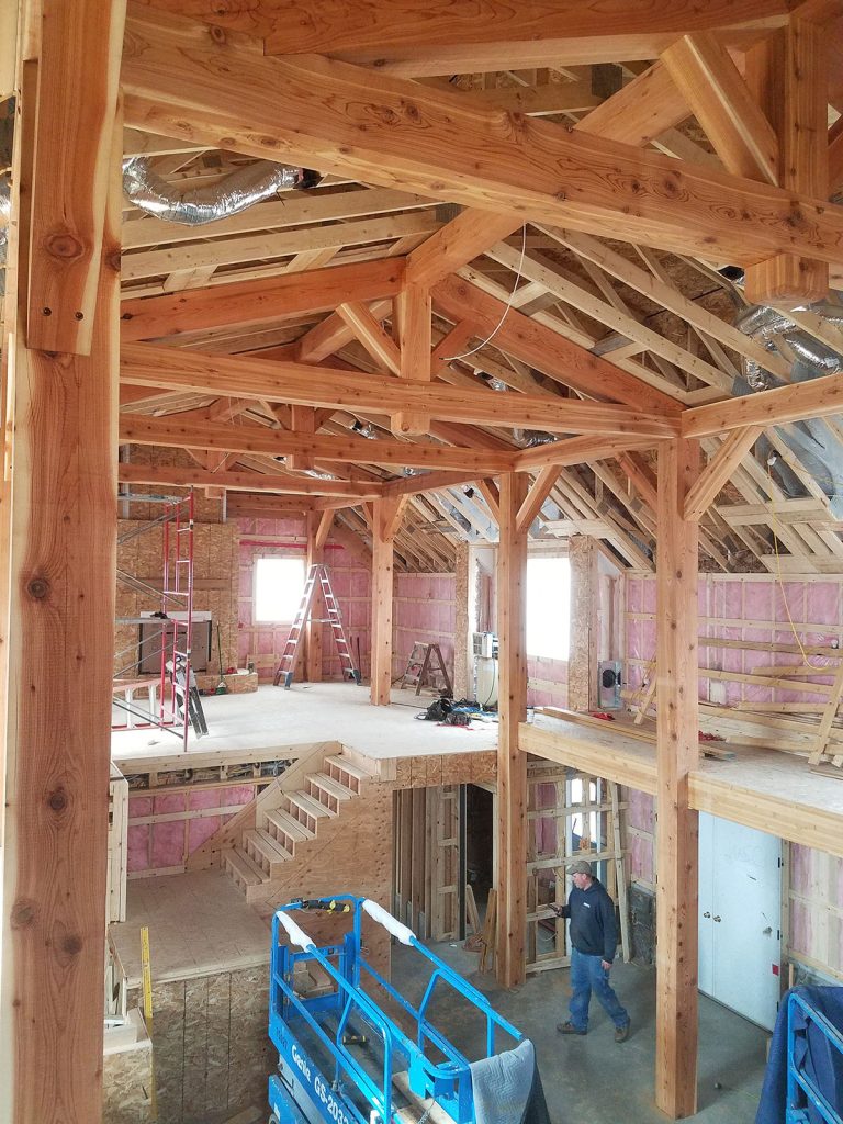 custom timber frame home interior during building