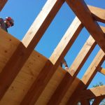 custom timber frame home being built