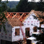 timber frame home being built