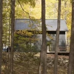 custom timber cabin with black siding