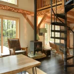 timber cabin interior with iron spiral staircase