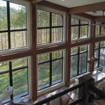 finished timber home interior with tall windows