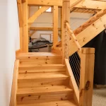 timber staircase with cable railing